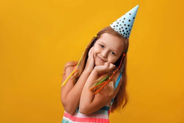 Birthday Cheerful Little Girl Cap Closeup Portrait Isolated Yellow Background — Stock Photo, Image