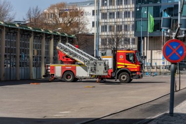 Volvo Magirus fire ladder truck being tested and cleaned at a fire station..
