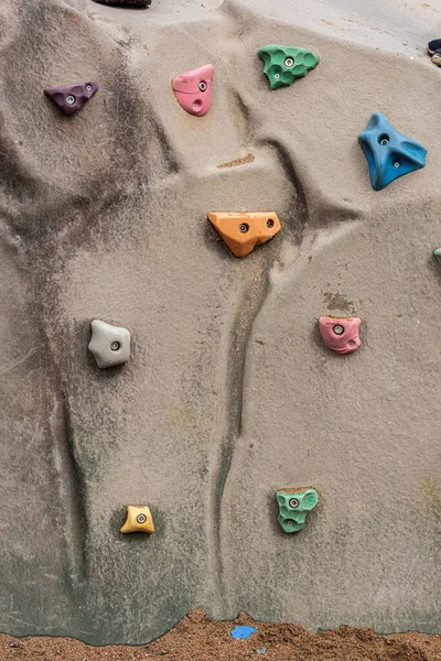 Multi colored climbing wall holds.