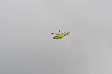 Ambulance helicopter high in the sky..