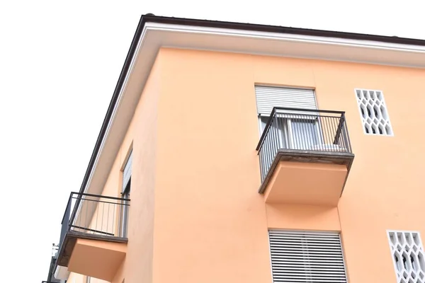 house with balconies and blinds on the window
