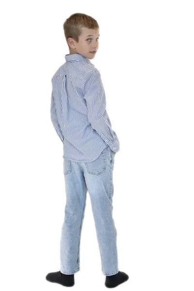 Boy Jeans Shirt Stands Looks Back White Background — Zdjęcie stockowe