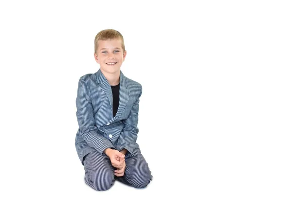 Boy Striped Suit Sits Smiles — Stockfoto
