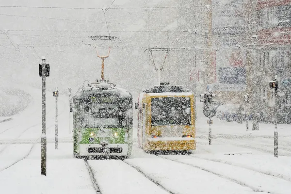 Winter city with trams and snow — Stock Photo, Image