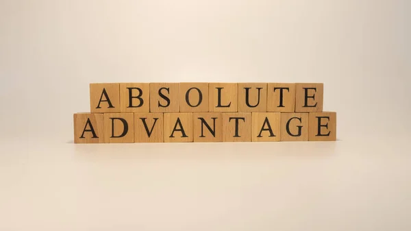 Absolute Advantage Sentence Written Wooden Surface Economy Concept — 图库照片