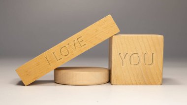 I love you written on wooden surface. gift and feelings.