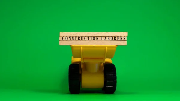 Word Construction Laborers Written Wooden Sticks Machine Concept Job Occupations — Zdjęcie stockowe