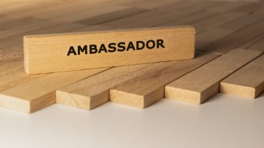 Ambassador written on wooden surface. Concept created from wooden sticks.