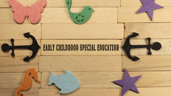 Early childhood special education written on wooden patterned surface. Education and child psychology.