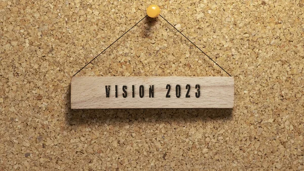 vision 2023 written on wooden surface. Wooden concept. Work and education, personal development.