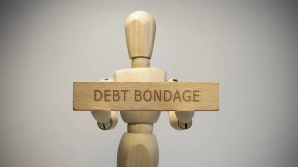Debt Bondage Signboard Written Wooden Man Holding Hand Social Issues — Stock Photo, Image