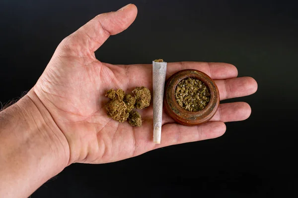 Hand Joint Buds Grinder Full Marijuana Black Background — Stockfoto