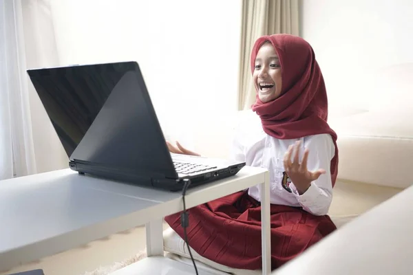 Cute Little Girl Wearing Red Hijab Doing Something Her Laptop — Stockfoto