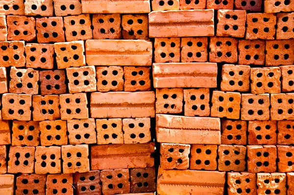 Orange brick with four hole — Stock Photo, Image