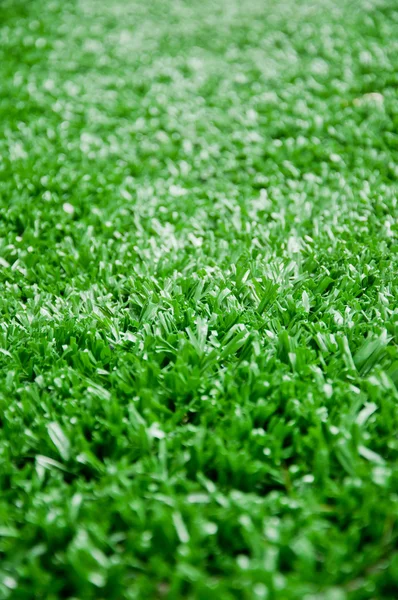 O astroturf para o futebol como fundo — Fotografia de Stock