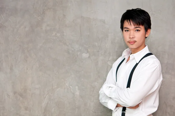 A teenager boy with white shirt and suspenders — Stock Photo, Image