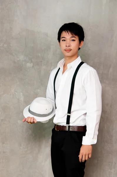 A teenager boy holds hat in his hand — Stock Photo, Image