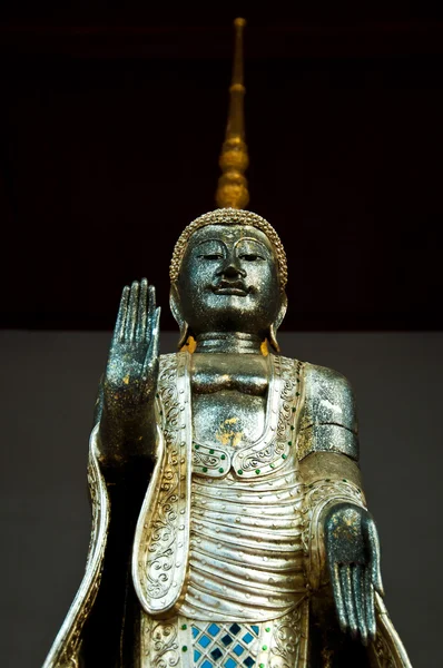 The metal standing Buddha with golden pagoda in the temple in Th — Stock Photo, Image