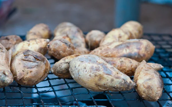 The grilled sweet potato on the roaster — Stock Photo, Image