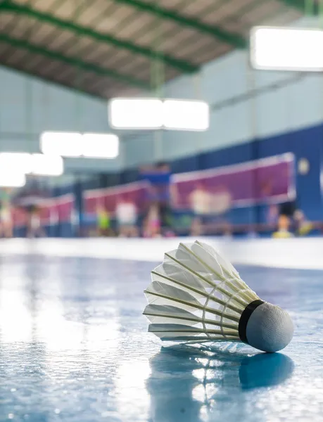 A shuttlecock on the ground in the Badminton court — Stock Photo, Image