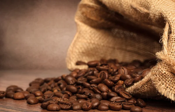 Coffee beans in coffee bag — Stock Photo, Image