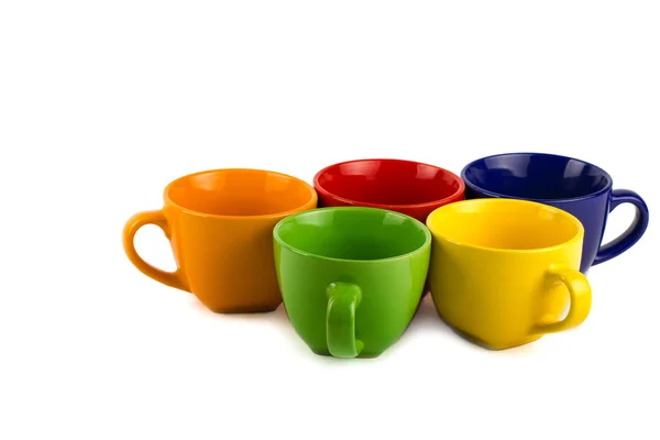 Set of empty colorful ceramic mugs — Stock Photo, Image