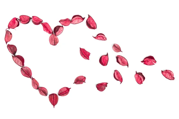 Pink potpourri spread in heart shape — Stock Photo, Image