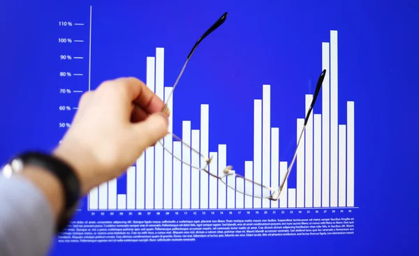 Image of hand pointing on a graph data — Stock Photo, Image
