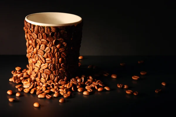Image of paper cup covered with coffee beans — Stock Photo, Image