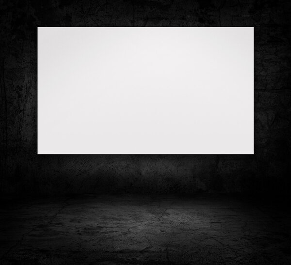 Image of blank billboard over dark concrete wall