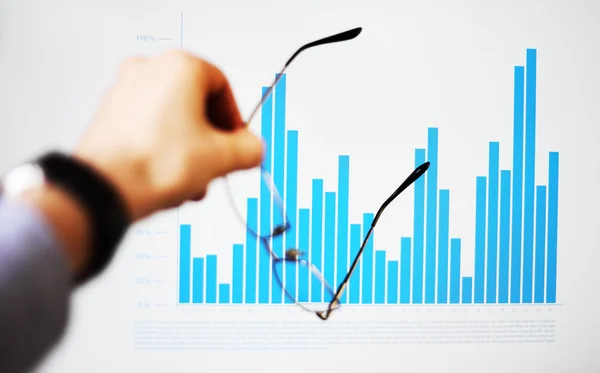 Image of hand pointing on a graph data — Stock Photo, Image
