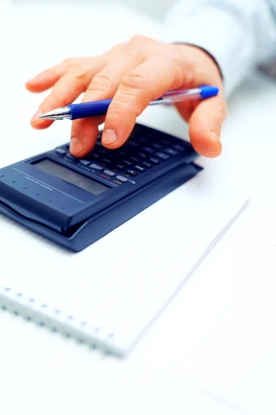 Closeup of a businessman calculating — Stock Photo, Image