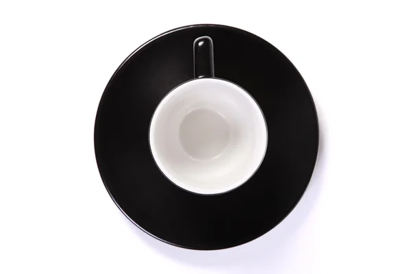 Felülnézete fekete kávé csésze és csészealj fehér — Stock Fotó