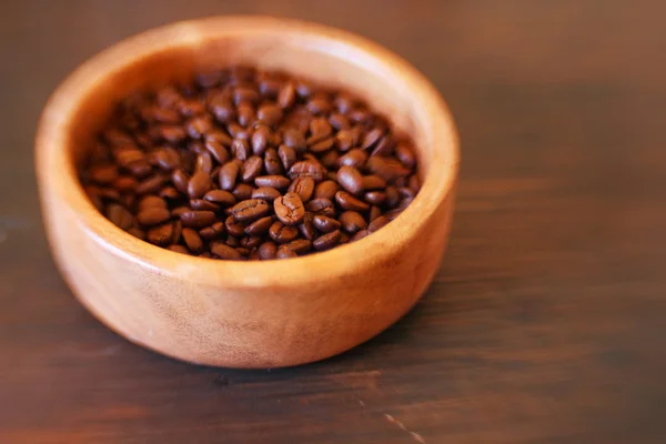 Image of coffee beans in wooden bowl. Selective focus — Stock Photo, Image