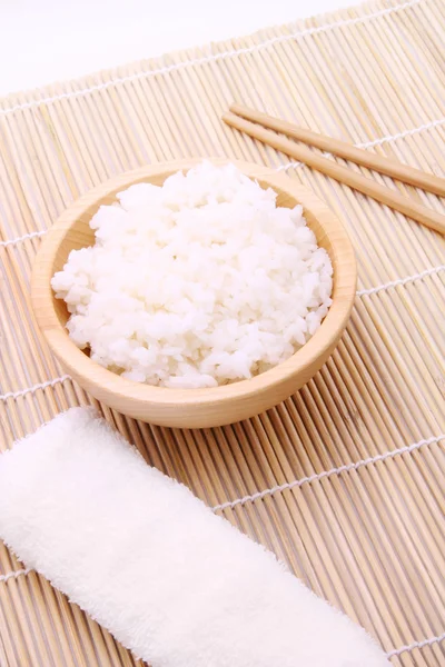 Rice in a wooden bowl — Stock Photo, Image