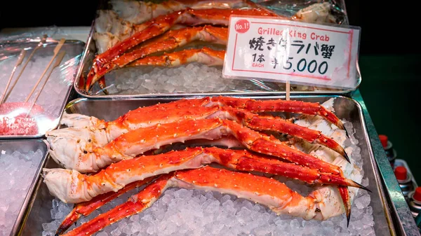 The famous Tsukiji fish market with retail shops sale crab legs and seafood in Tokyo. Outer market, a largest wholesale seafood market in the world