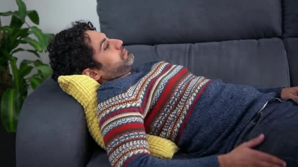 Face Thoughtful Adult Man Looking Pensive While Lying Couch Home — Stock Video
