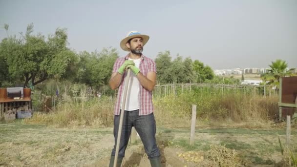 Portrait Modern Bearded Farmer Man Take Break Hoe Hands Stands — Stockvideo