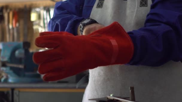 Slowmotion Man Welder Putting Red Gloves Protect Hands Worker Wearing — Vídeos de Stock