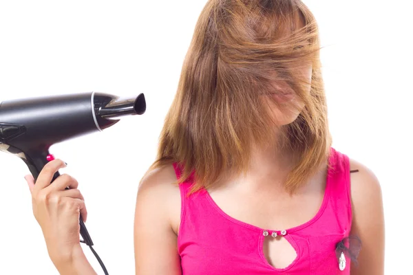 Girl dries hair with electrical appliance — Stock Photo, Image