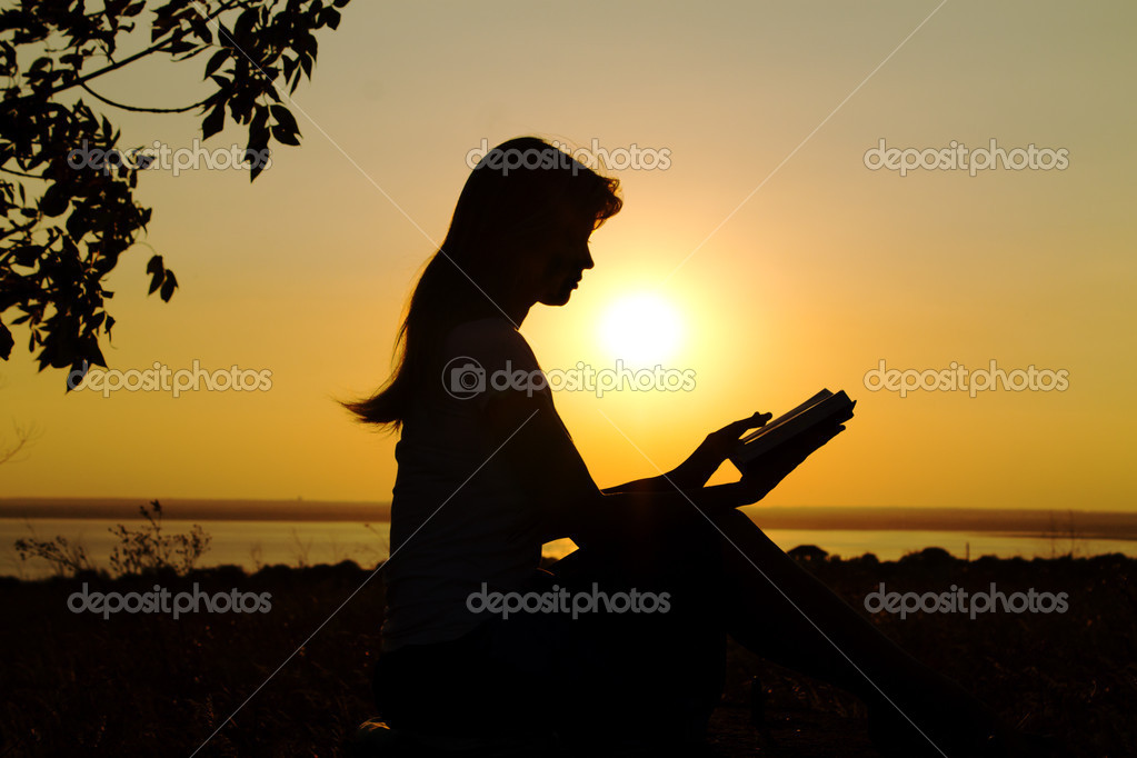 young girl reading silhouette