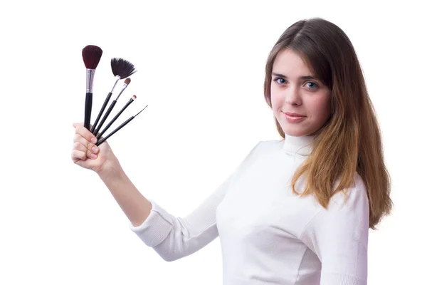 Schöne Mädchen mit einem Satz Pinsel für Make-up in ihren Händen — Stockfoto