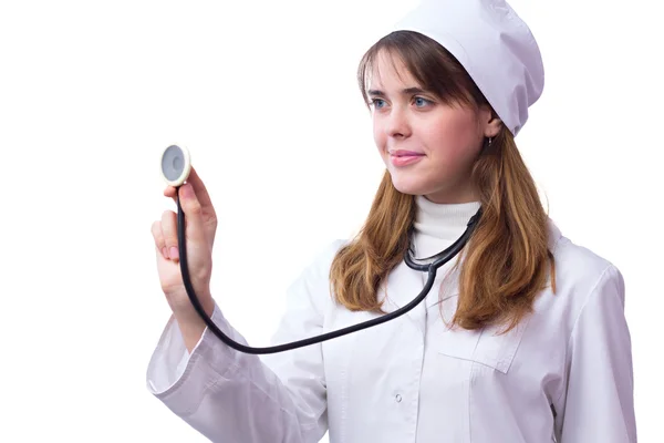 Young woman doctor with phonendoscope examines — Stock Photo, Image