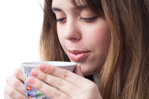 Portrait of a beautiful girl with a cup of tea in her hands — Stock Photo, Image