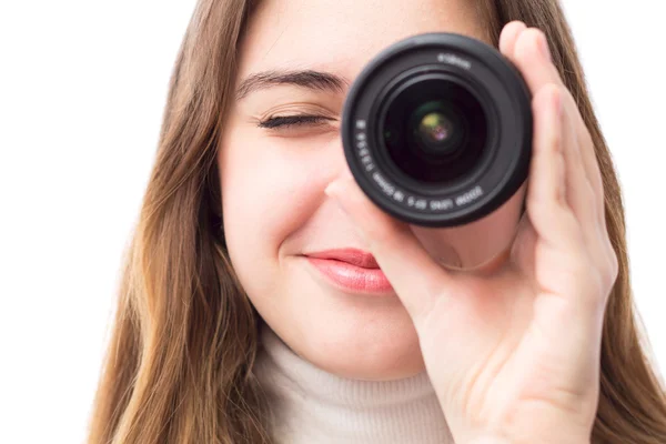 Retrato de una hermosa chica con la lente cerca del ojo — Foto de Stock