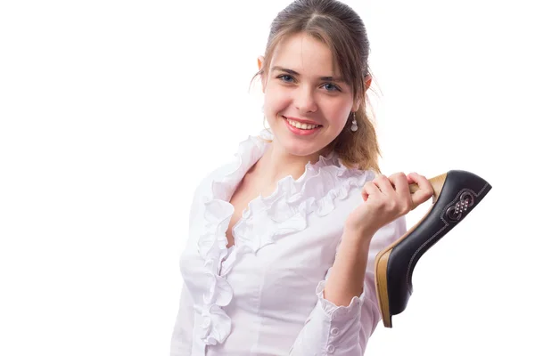 Beautiful girl advertises high-heeled shoes in her hands — Stock Photo, Image