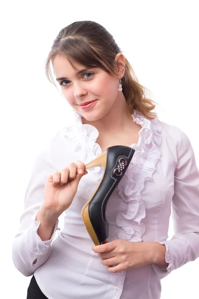 Beautiful girl advertises high-heeled shoes in her hands — Stock Photo, Image