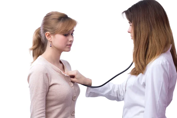 Doctor examines the patient listening to the heartbeat — Stock Photo, Image