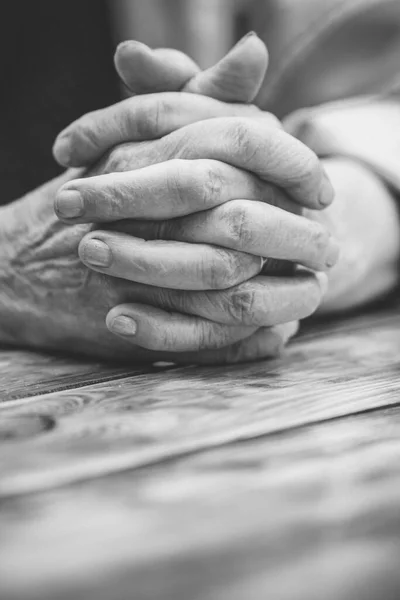 Elderly woman with folded hands. Hands of an old woman close up, life concept