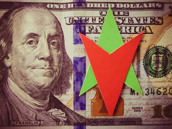 The concept of dollar exchange rate fluctuations. Arrows showing up and down. Currency circulation. Buying and selling dollars. The value of the currency. The US real estate market.